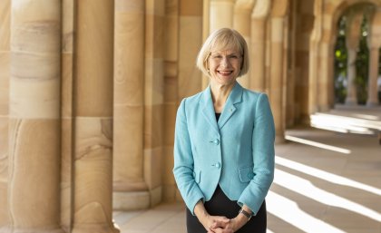 UQ Vice-Chancellor stands in the cloisters of the Great Court at the St Lucia campus.